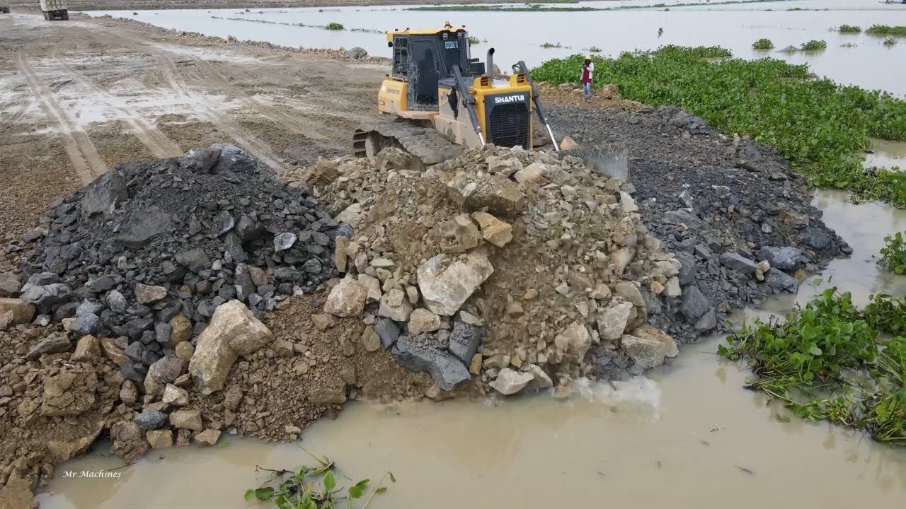 Awesome new road building mighty machines across the lake continuing construction