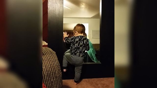 Baby Boy Baffled By Mirror