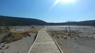 On a boardwalk in Norris Geyser Basin