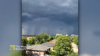 Watching the storm approach under sunny skies