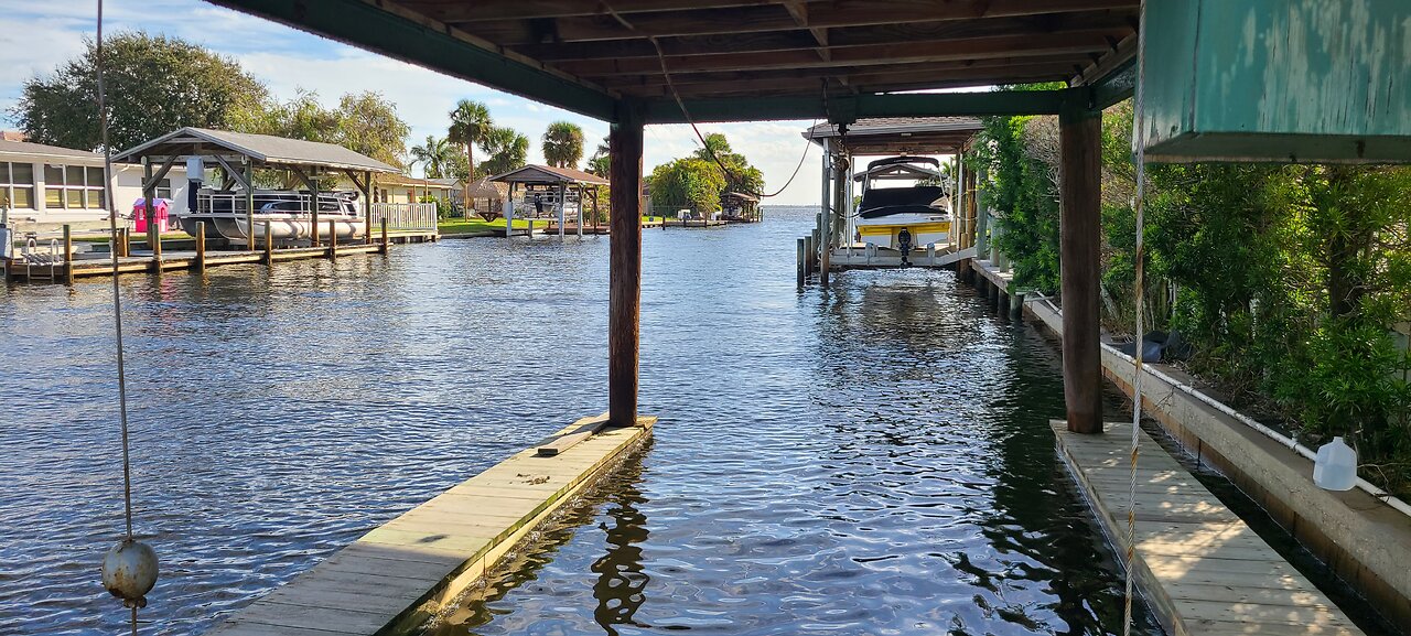 Sitting At The Dock of a Channel