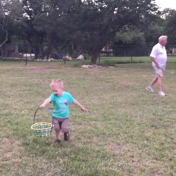 "A Tot Boy Runs To Show His Mom His Easter Eggs But Trips"