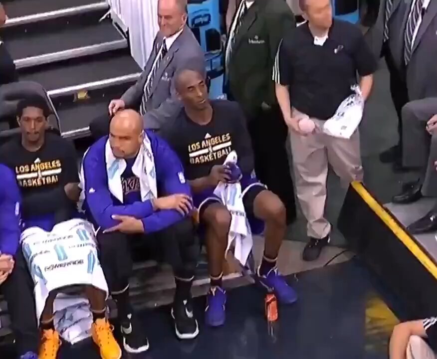 Kobe gives his arm sleeve to a fan, then other fans steal it💀