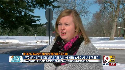 Woman says drivers are using her yard as street