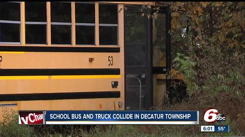 13 students hurt following crash between school bus and a small truck