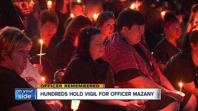 Fallen officer honored by hundreds at vigil