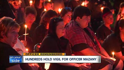 Fallen officer honored by hundreds at vigil