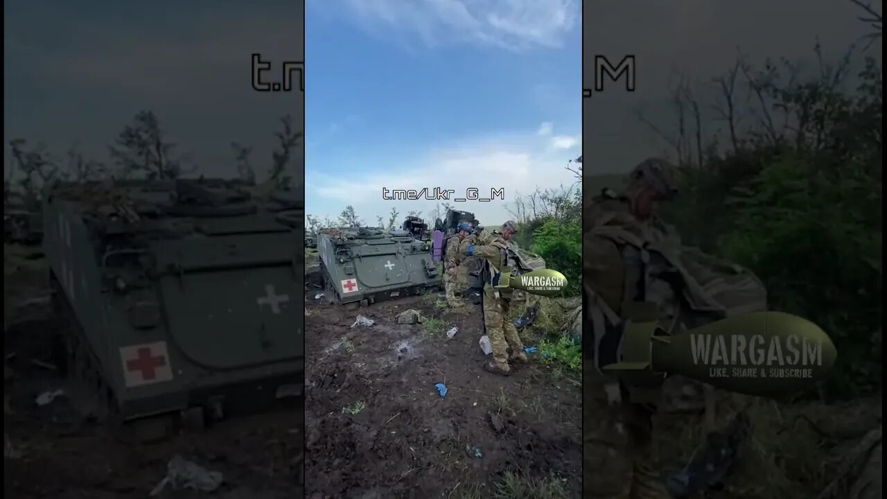 Ukrainian troops ready to leave their armored graveyard