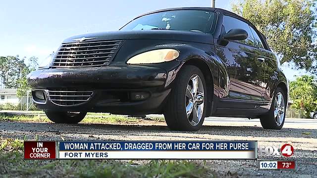 Woman robbed at gun point, then dragged from her car for her purse