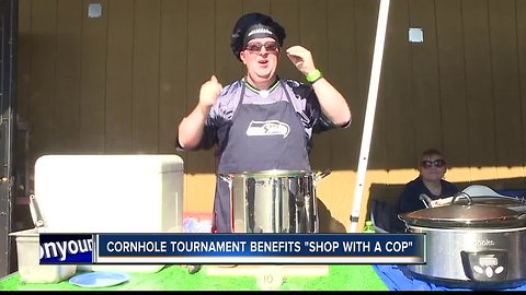 Corn hole tournament benefits "Shop with a Cop"