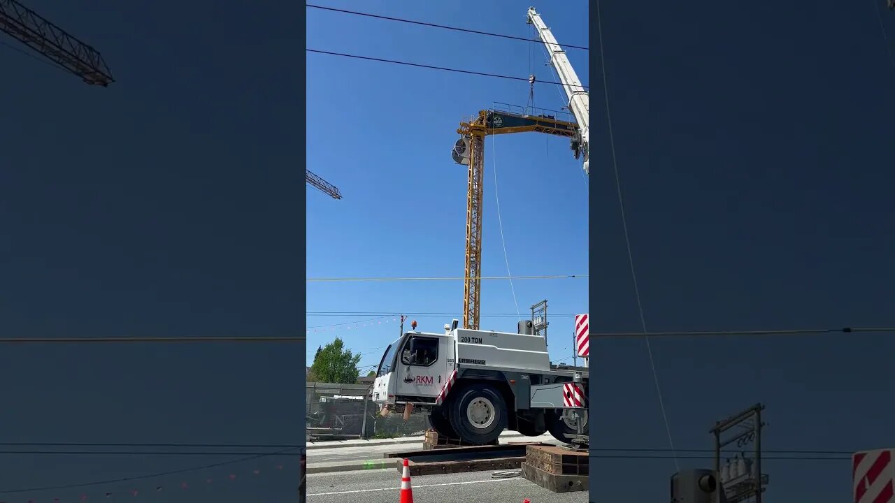 Crane erection at E Broadway and Renfrew St