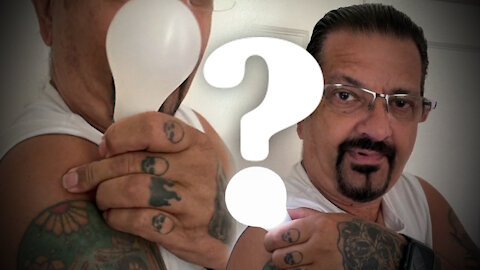 Man Lights Light Bulb With Arm After COVID Vaccine