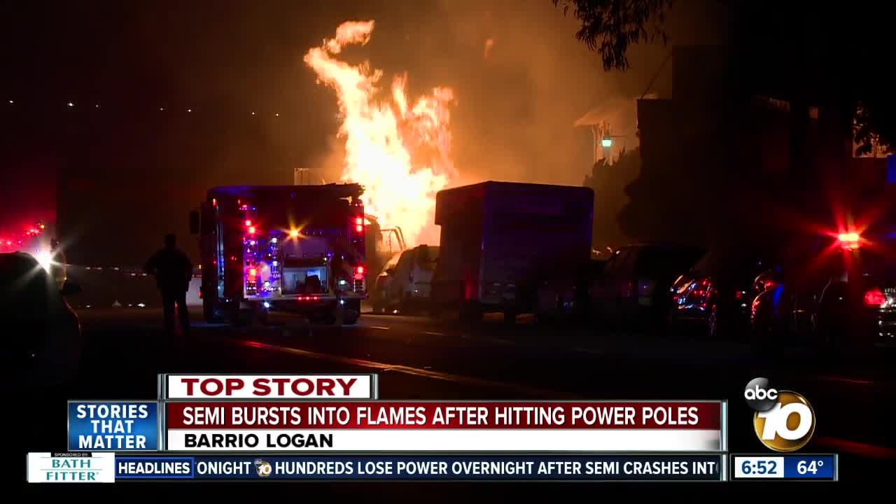 Driver escapes serious injury after semi-truck crashes into power poles, bursts into flames