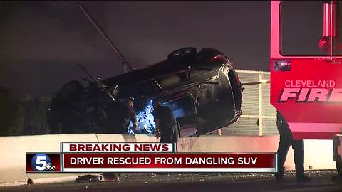 Driver rescued from dangling SUV after crash on Pearl Rd. bridge