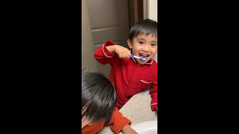 Twins Brushing Teeth