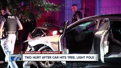 Two people hospitalized after car hits tree, light pole in Amherst