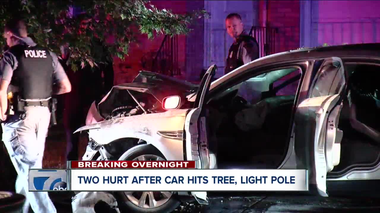 Two people hospitalized after car hits tree, light pole in Amherst
