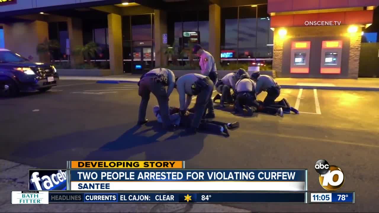 Two people arrested for violating curfew