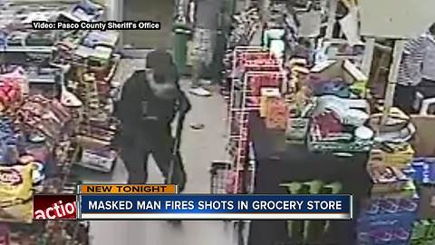 Masked robber fires shot into store ceiling before stealing cash