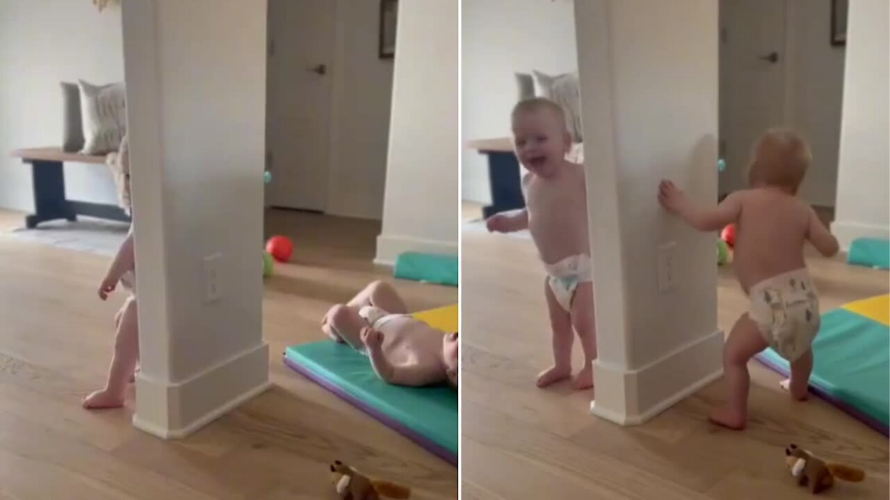 Twin babies playing hide and seek with adorable laughing