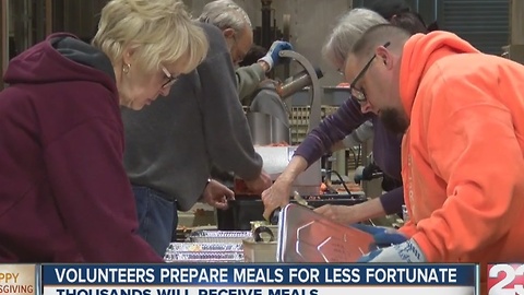 Volunteers prepare meals for Thanksgiving