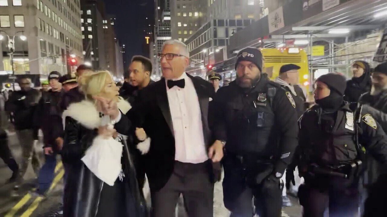 A Pro-Israel Supporter Is Escorted Through The Crowd Of Pro-Palestinian Protestors In New York City