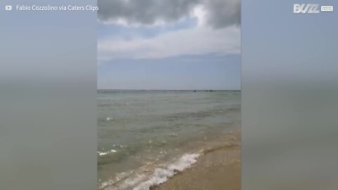 Sand swirl scatters beachgoers in Italy