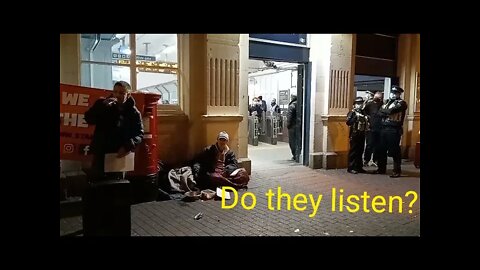 Police look on at a Stand Up X speech