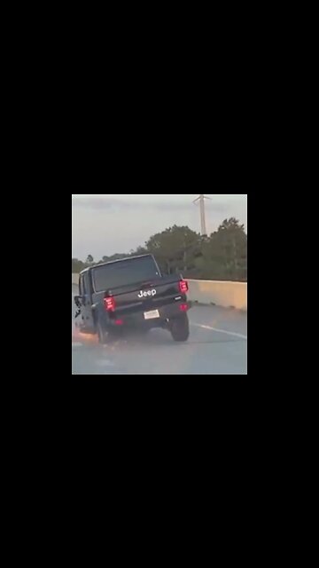 Jeep Gladiator driving on highway missing its tires