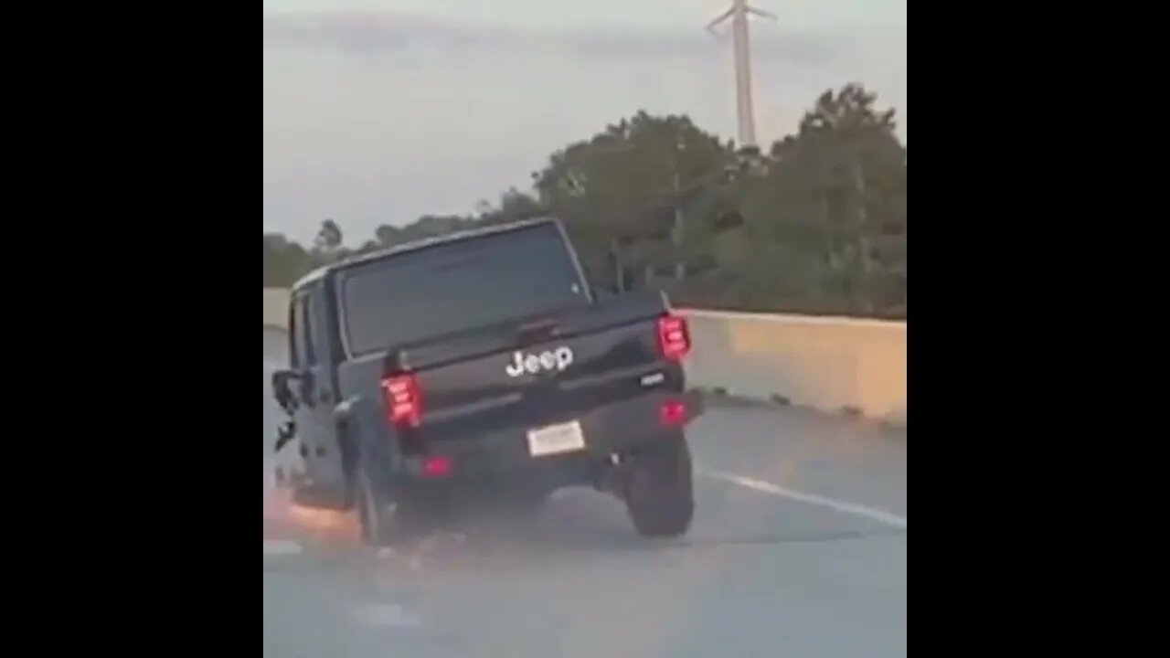 Jeep Gladiator driving on highway missing its tires