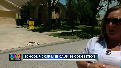 Car pick-up line clogging Westchase roads, trapping neighbors in driveways