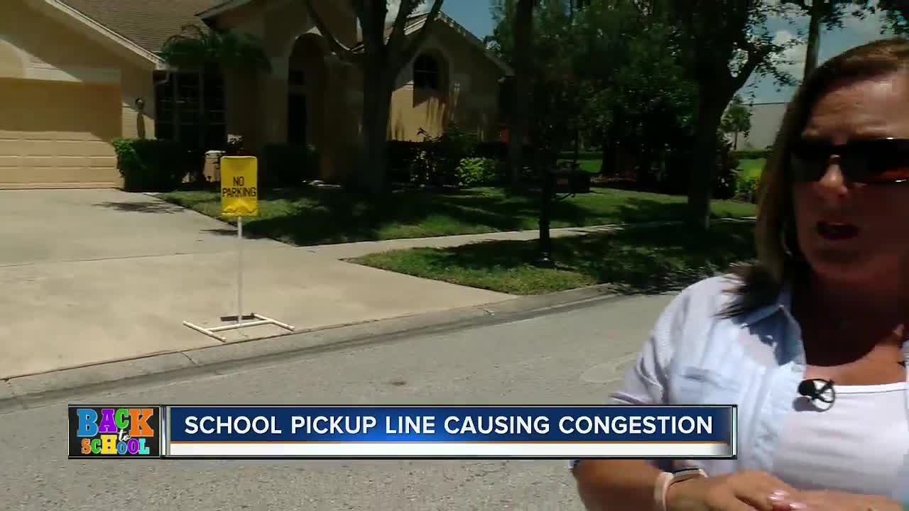 Car pick-up line clogging Westchase roads, trapping neighbors in driveways