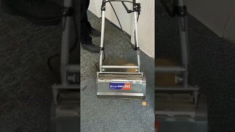 Students learning low moisture spotting techniques during carpet care class at the Academy