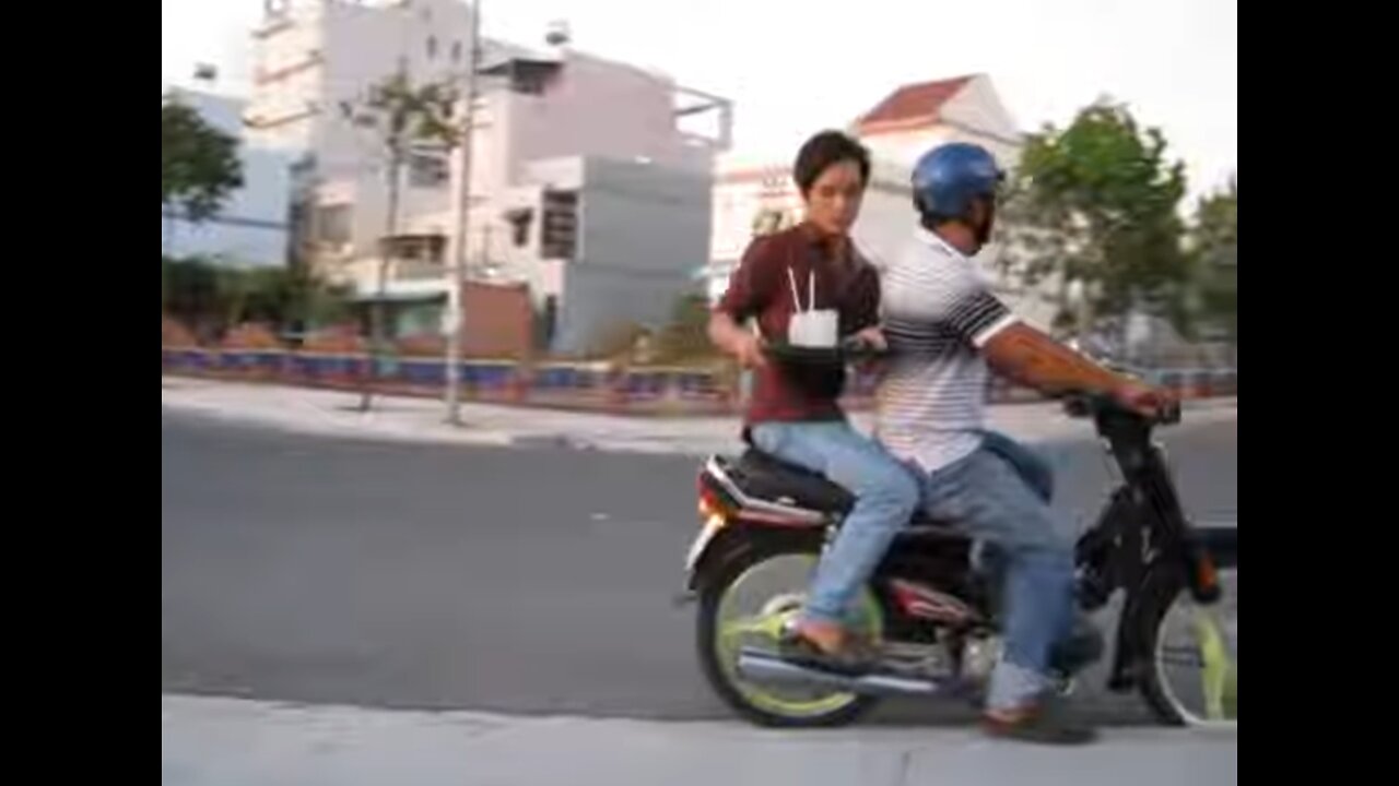 Vietnam, Binh Duong, Thu Dau Mot - motorbike waiter 2013