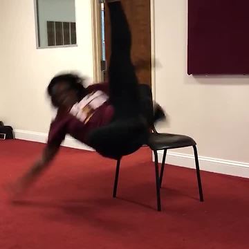 Cheerleader Falls Off Her Chair While Performing Her Dance Routine
