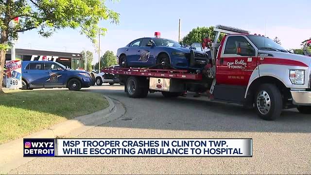 MSP trooper escorting ambulance T-bones SUV