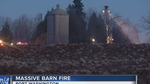 Multiple fire departments battle massive Port Washington barn fire