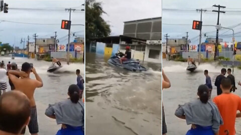 People riding jet ski on flooded street