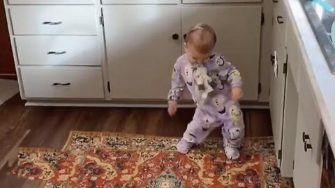 Baby doing funny dance and Mommy recording it