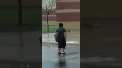 Kid standing in rain after school (guts theme)