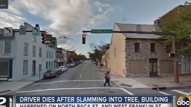 Driver dies after slamming into tree, building in downtown Baltimore