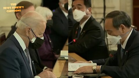 Off the teleprompter: Biden and Japanese prime minister reading cards to each other.