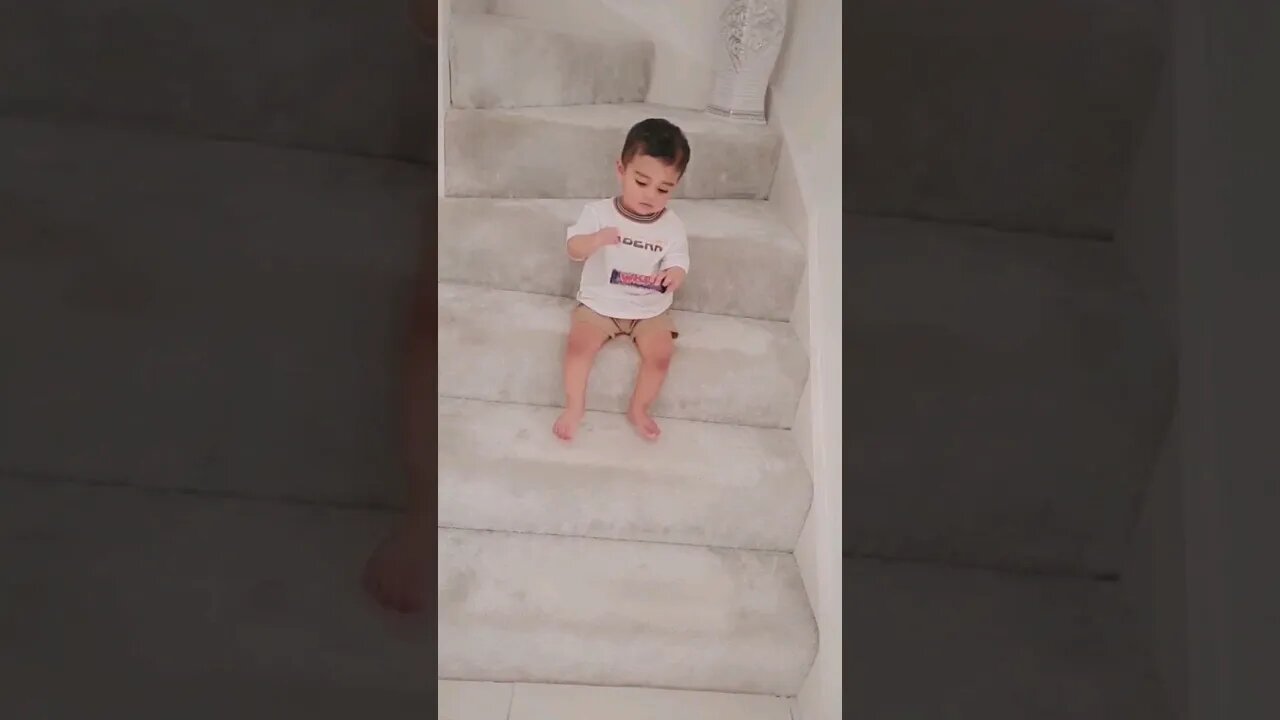 Cute baby 🤪😜 trying to open a chocolate bar. #viral #trending #chocolate #shorts