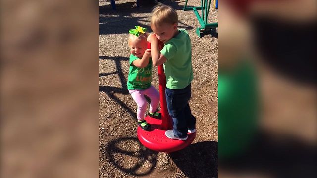 Little Girl Gets Dizzy On The Playground