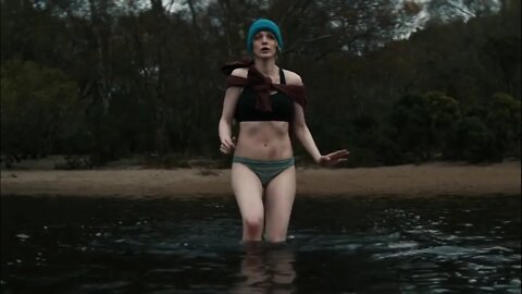 Girl shivering from cold in water