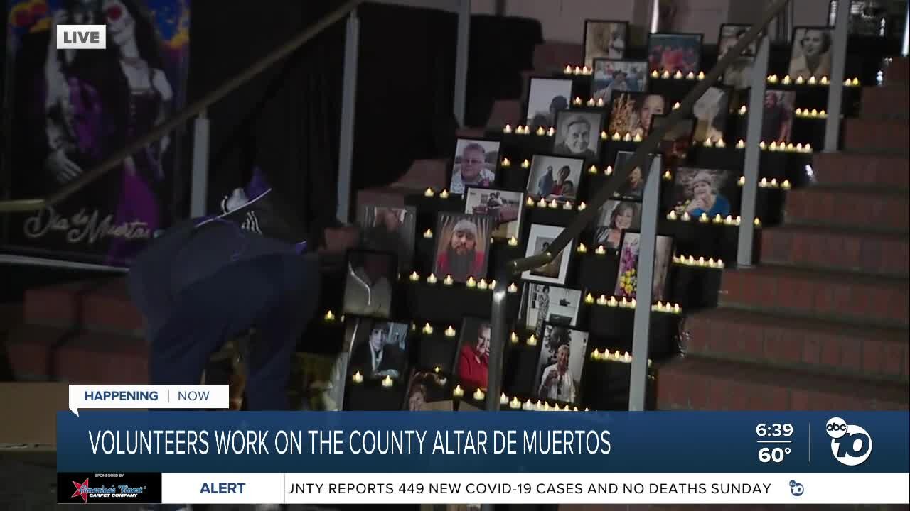 Volunteers work on Altar De Muertos at San Diego County building