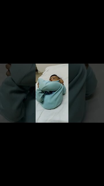 4 months old baby trying to roll over #shorts