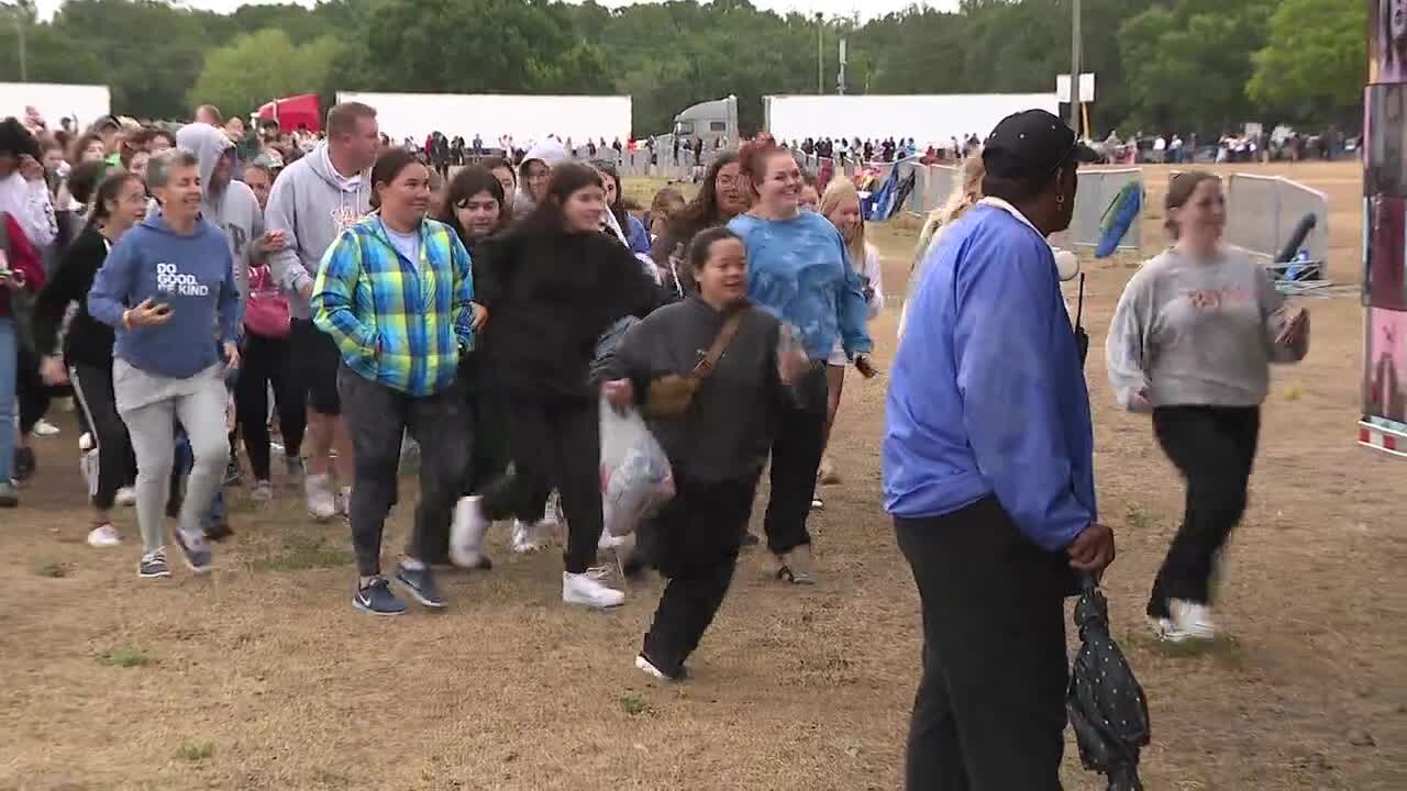 WATCH: Taylor Swift fans rush the merchandise booth as they open