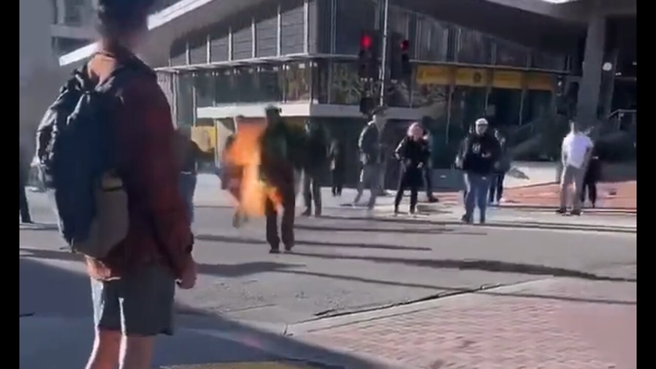 People Try To Extinguish Man On Fire, One Guy Hits Him With A Bike? - HaloRockNews