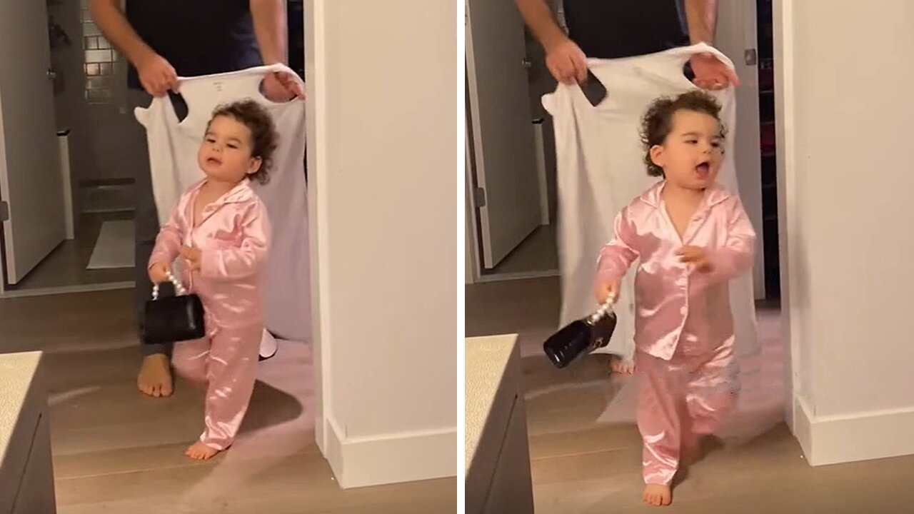 Little girl has adorable reaction to dad holding a sleep sack